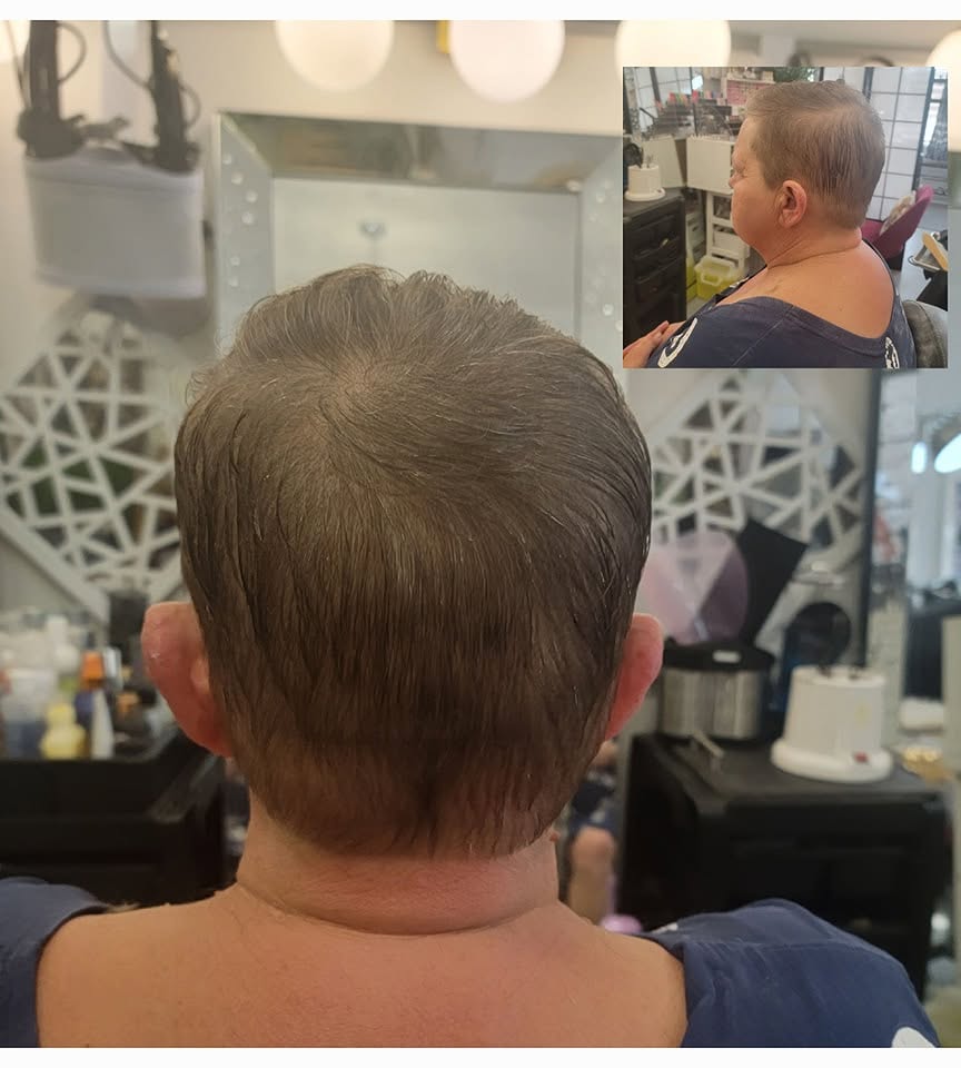 Clean short haircut finish shown from the back