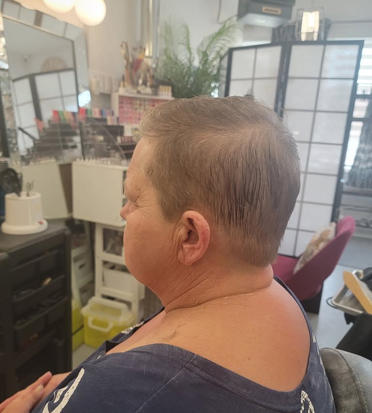 Softly shaped short haircut shown from the side