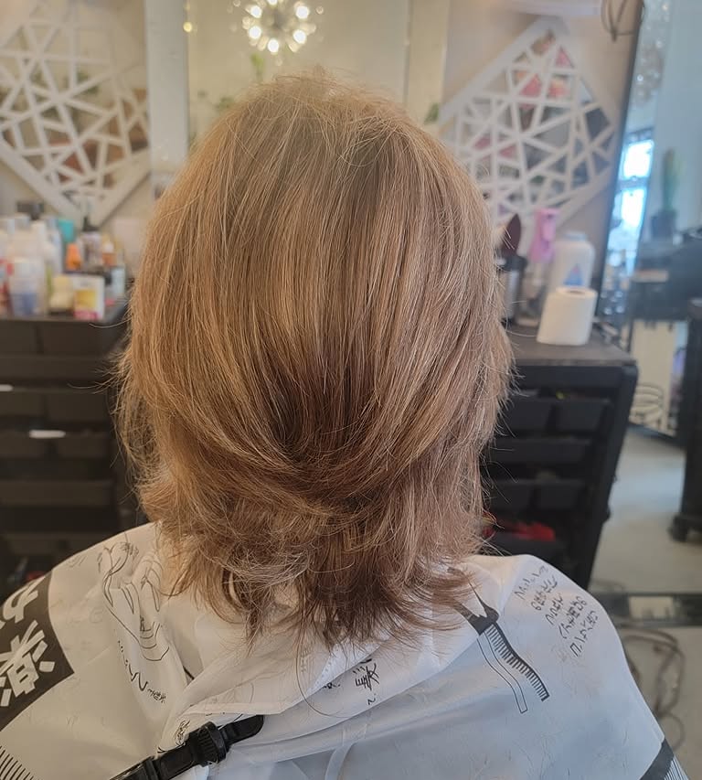 Shoulder-length layered haircut shown from the back