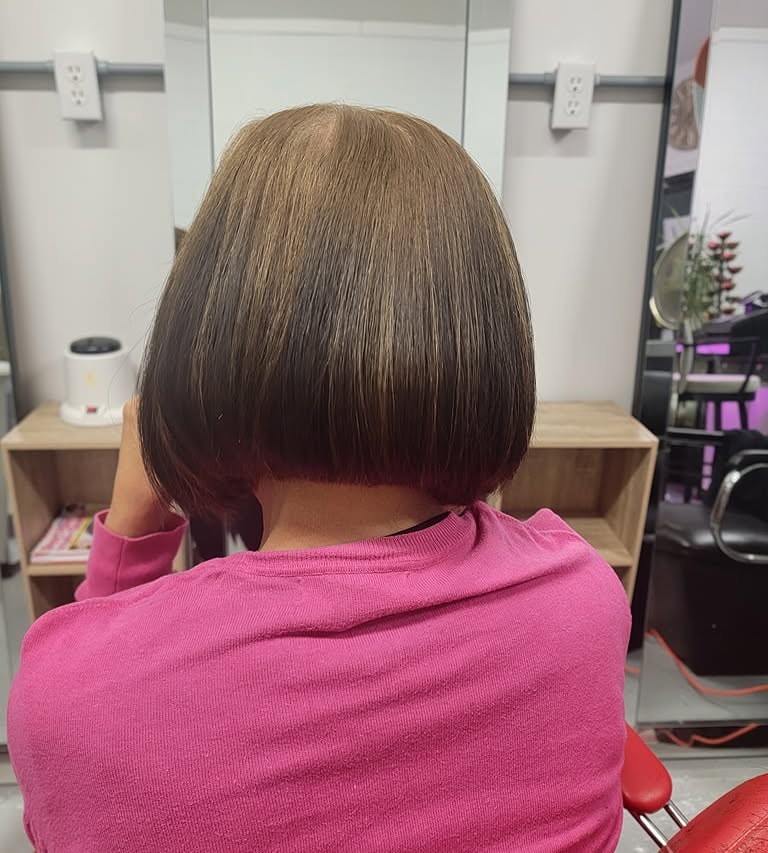 Sleek bob haircut photographed from the back