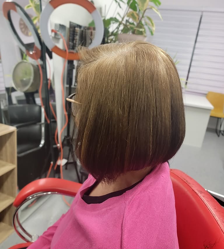 Sleek bob haircut photographed from the side